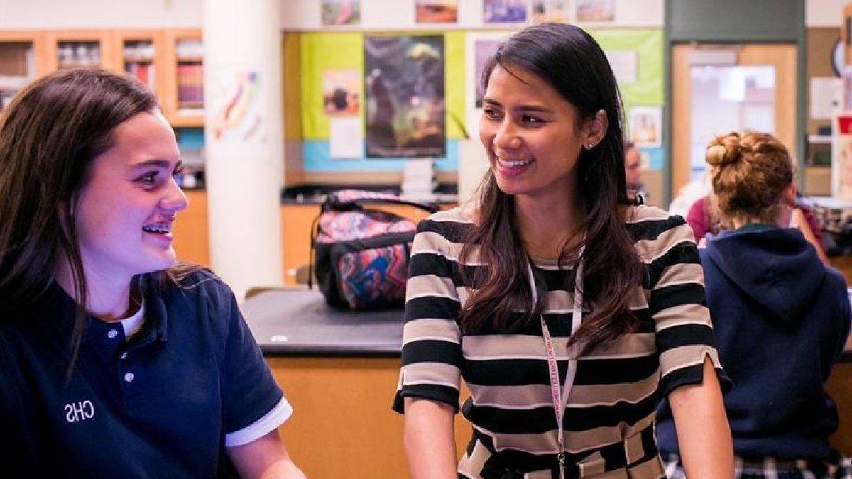 A teacher with students in a classroom